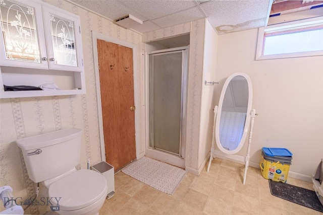 602 1st Ave E, Three Forks, MT 59752 - full bath with a shower stall, toilet, wallpapered walls, baseboards, and tile patterned floors