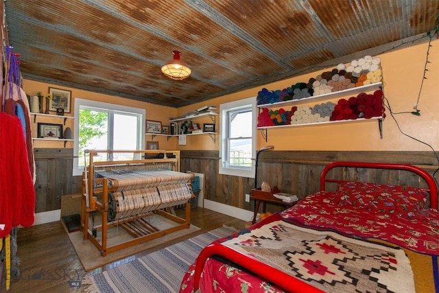 49 Redtail Hawk Rd, Mcallister, MT 59740 - bedroom featuring a wainscoted wall, wood finished floors, wooden ceiling, and wooden walls
