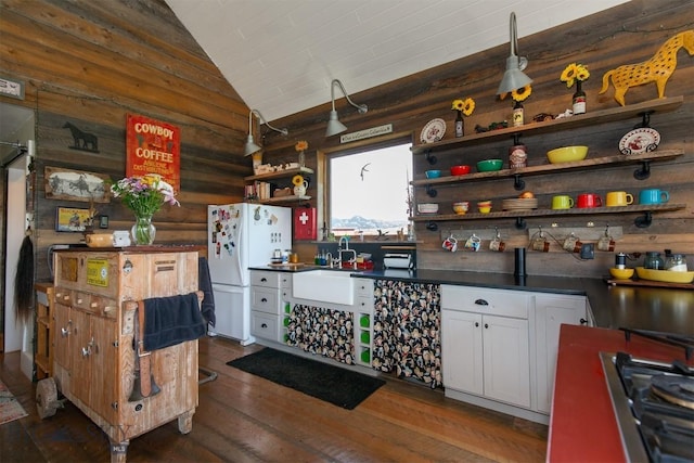 49 Redtail Hawk Rd, Mcallister, MT 59740 - kitchen featuring open shelves, freestanding refrigerator, gas cooktop, dark countertops, and lofted ceiling