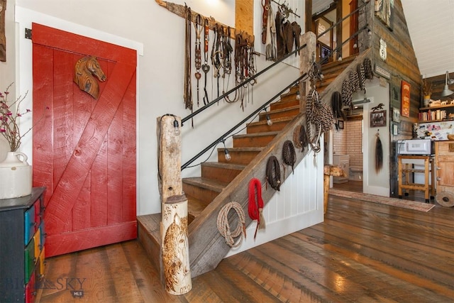 49 Redtail Hawk Rd, Mcallister, MT 59740 - stairway featuring hardwood / wood-style flooring and baseboards