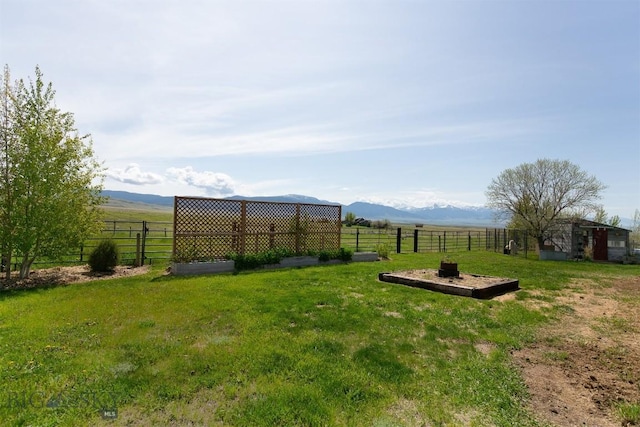 49 Redtail Hawk Rd, Mcallister, MT 59740 - view of yard featuring a mountain view and an outbuilding