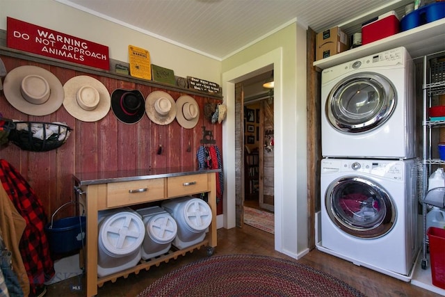 49 Redtail Hawk Rd, Mcallister, MT 59740 - laundry room with stacked washer and clothes dryer, wood finished floors, wood walls, and crown molding