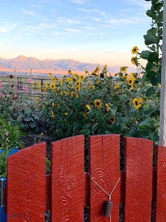 49 Redtail Hawk Rd, Mcallister, MT 59740 - yard at dusk with a mountain view