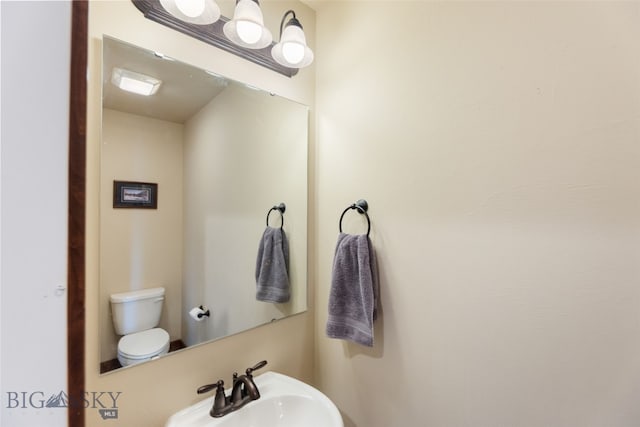 4426 Ethan Way, Bozeman, MT 59718 - half bathroom featuring a sink and toilet