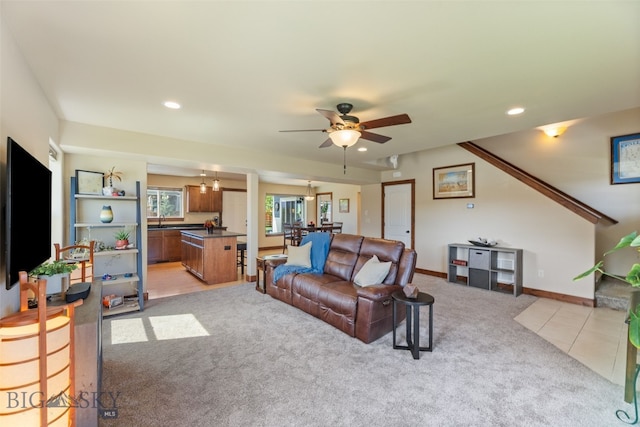 4426 Ethan Way, Bozeman, MT 59718 - living room with light colored carpet, recessed lighting, ceiling fan, a chandelier, and baseboards