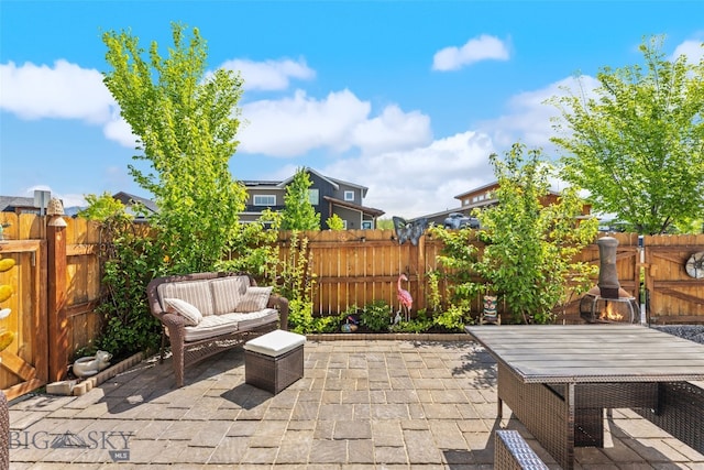 4426 Ethan Way, Bozeman, MT 59718 - fenced backyard featuring a patio and outdoor dining space