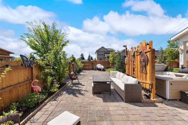 4426 Ethan Way, Bozeman, MT 59718 - fenced backyard featuring a patio and an outdoor hangout area