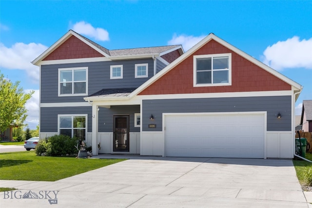 4426 Ethan Way, Bozeman, MT 59718 - view of front of house featuring concrete driveway, a front yard, and a standing seam roof