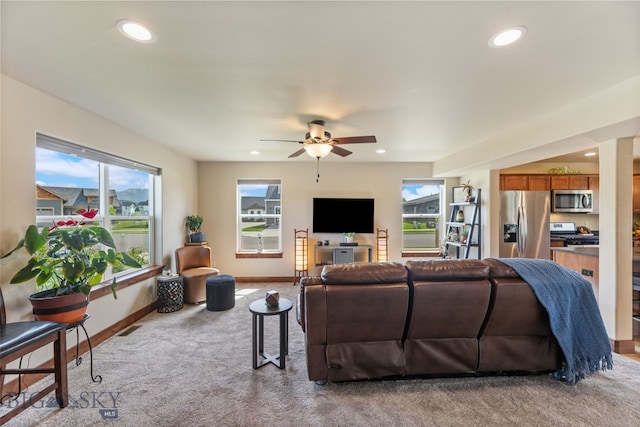 4426 Ethan Way, Bozeman, MT 59718 - living room featuring light carpet, ceiling fan, baseboards, and recessed lighting
