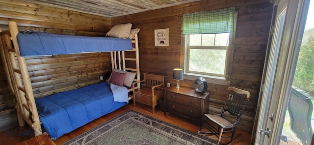 747 Upper Ruby Rd, Alder, MT 59755 - bedroom featuring wooden walls, wood finished floors, and wood ceiling