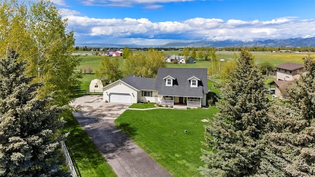 125 N Pheasant Dr, Bozeman, MT 59718 - view of front facade with a porch, driveway, and a garage