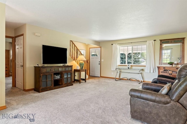 125 N Pheasant Dr, Bozeman, MT 59718 - living room featuring baseboards, carpet floors, and stairway