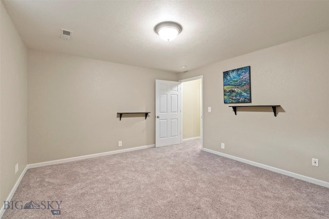 125 N Pheasant Dr, Bozeman, MT 59718 - carpeted spare room featuring baseboards and a textured ceiling