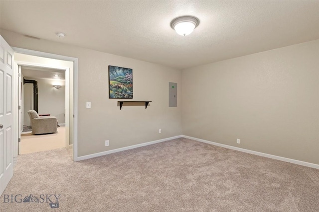 125 N Pheasant Dr, Bozeman, MT 59718 - carpeted spare room featuring a textured ceiling, a smoke detector, baseboards, and electric panel