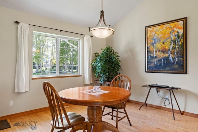 125 N Pheasant Dr, Bozeman, MT 59718 - dining area with light wood finished floors, baseboards, and lofted ceiling