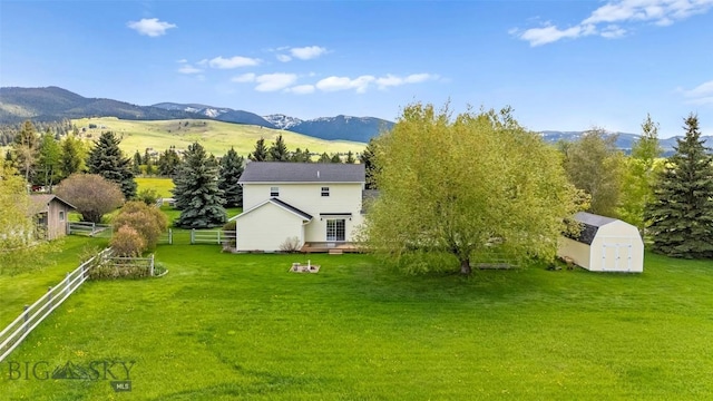 125 N Pheasant Dr, Bozeman, MT 59718 - view of yard with a deck with mountain view