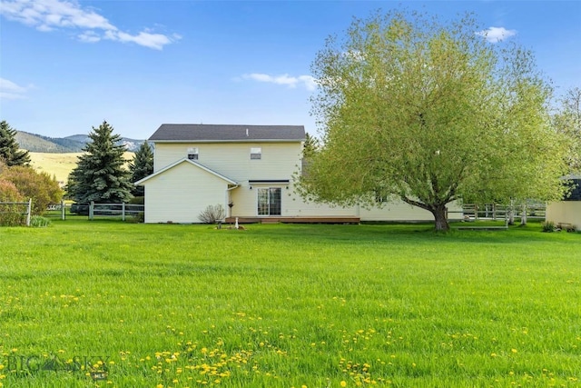 125 N Pheasant Dr, Bozeman, MT 59718 - rear view of house with a deck with mountain view