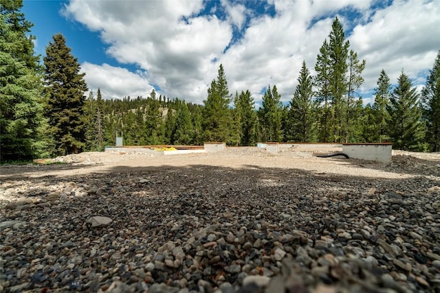 715 Colters Run Loop Lot 25, Gallatin Gateway, MT 59730 - view of yard featuring a forest view