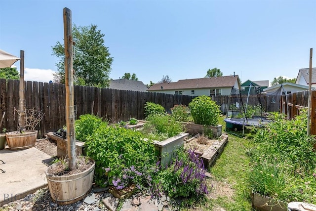 577 W Shore Dr, Belgrade, MT 59714 - fenced backyard with a garden