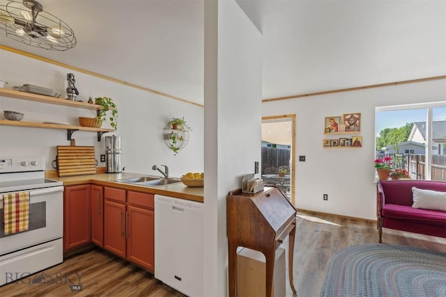 577 W Shore Dr, Belgrade, MT 59714 - kitchen featuring white appliances, a sink, open shelves, and wood finished floors