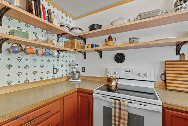 577 W Shore Dr, Belgrade, MT 59714 - kitchen featuring white range with electric cooktop, open shelves, and light countertops