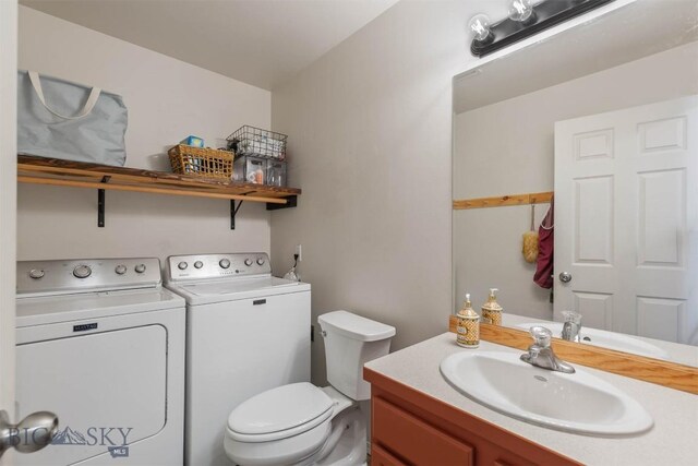577 W Shore Dr, Belgrade, MT 59714 - bathroom with washer and clothes dryer, toilet, and vanity