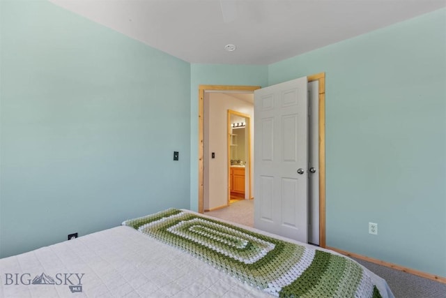 577 W Shore Dr, Belgrade, MT 59714 - bedroom featuring baseboards and light carpet