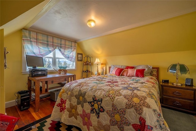 207 2nd St E, Clyde Park, MT 59018 - bedroom featuring ornamental molding, wood finished floors, vaulted ceiling, and baseboards