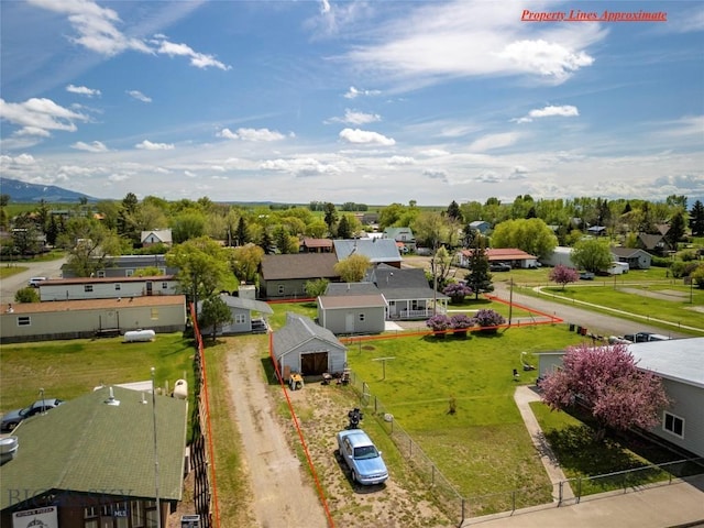 207 2nd St E, Clyde Park, MT 59018 - aerial view of residential area with mountains