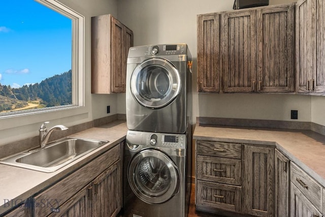 405 Swayback Rd, Mcallister, MT 59740 - laundry area with stacked washing machine and dryer and cabinet space