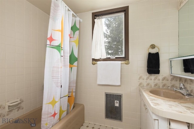 1930 Yellowtail, Big Sky, MT 59716 - full bath featuring tile walls, vanity, shower / tub combo, and heating unit