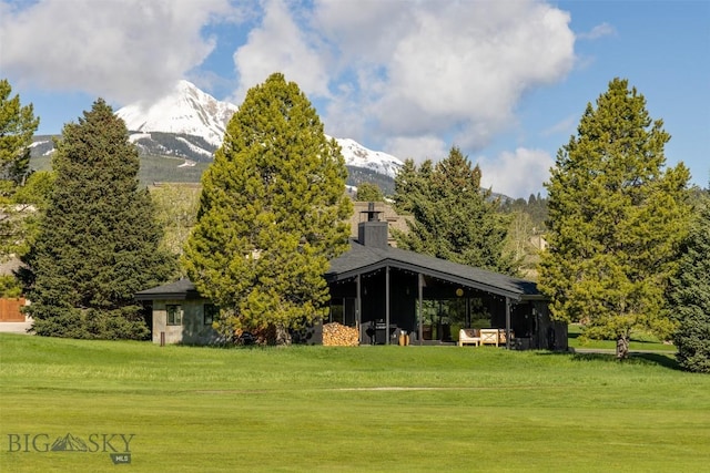 1930 Yellowtail, Big Sky, MT 59716 - view of property's community with a yard and a mountain view