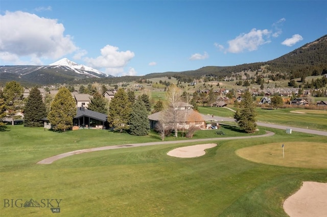 1930 Yellowtail, Big Sky, MT 59716 - view of community with a mountain view, a putting green, view of golf course, and a lawn