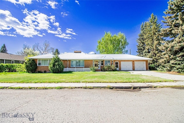 2200 Argyle St, Butte, MT 59701 - single story home featuring brick siding, an attached garage, driveway, and a front yard
