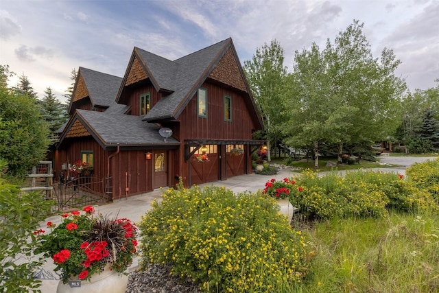 45 Cutthroat Trout, Big Sky, MT 59716 - view of home's exterior with a shingled roof and driveway