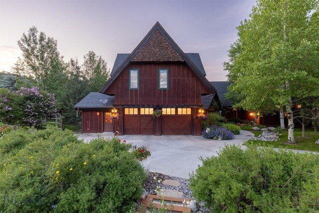 45 Cutthroat Trout, Big Sky, MT 59716 - view of front of house featuring concrete driveway and a shingled roof
