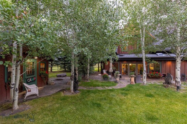 45 Cutthroat Trout, Big Sky, MT 59716 - view of grassy yard featuring a patio