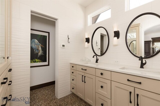 45 Cutthroat Trout, Big Sky, MT 59716 - full bathroom featuring double vanity and baseboards