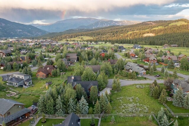45 Cutthroat Trout, Big Sky, MT 59716 - aerial overview of property's location featuring a forest, mountains, and nearby suburban area