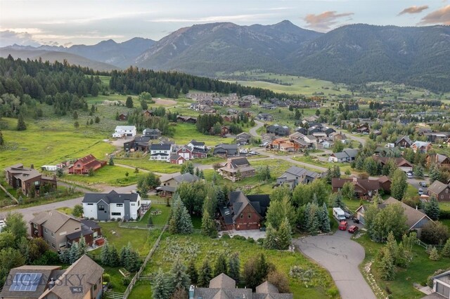 45 Cutthroat Trout, Big Sky, MT 59716 - view of property location with a mountain backdrop and nearby suburban area