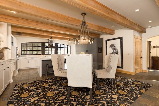 45 Cutthroat Trout, Big Sky, MT 59716 - dining space featuring beamed ceiling, recessed lighting, baseboards, stone tile flooring, and arched walkways