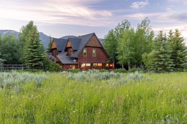 45 Cutthroat Trout, Big Sky, MT 59716 - rear view of property featuring a shingled roof and a mountain view