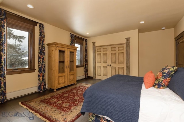 45 Cutthroat Trout, Big Sky, MT 59716 - bedroom featuring recessed lighting, a baseboard radiator, and baseboard heating