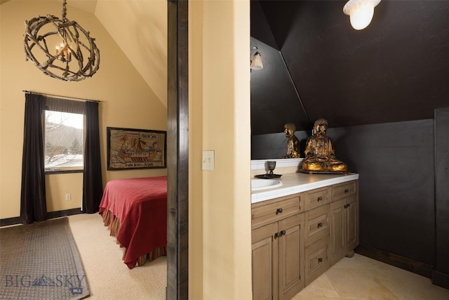 45 Cutthroat Trout, Big Sky, MT 59716 - bathroom featuring lofted ceiling, vanity, tile patterned floors, and baseboards