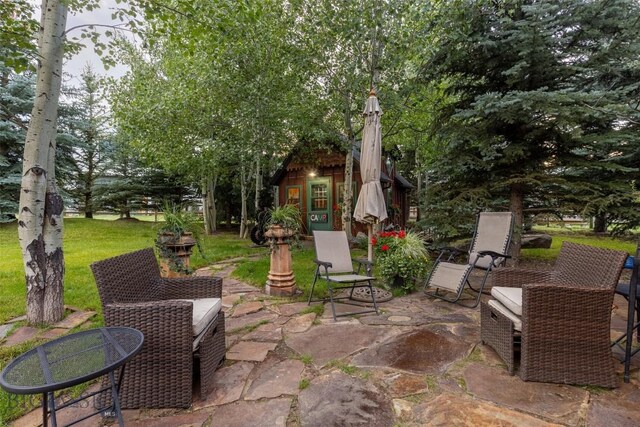 45 Cutthroat Trout, Big Sky, MT 59716 - view of patio with an outbuilding