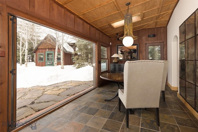 45 Cutthroat Trout, Big Sky, MT 59716 - dining area featuring wooden walls, vaulted ceiling, and arched walkways