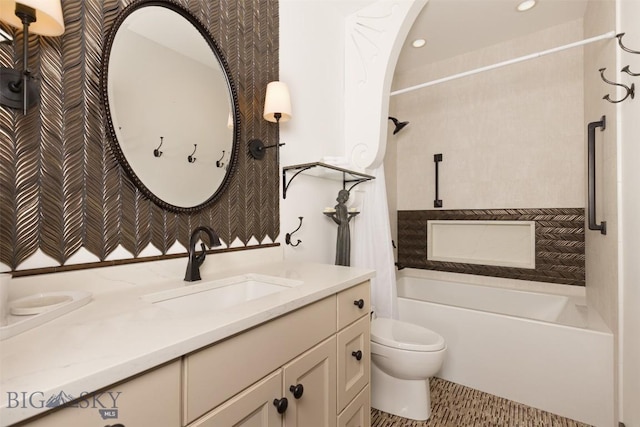 45 Cutthroat Trout, Big Sky, MT 59716 - bathroom featuring toilet, vanity,  shower combination, wallpapered walls, and recessed lighting