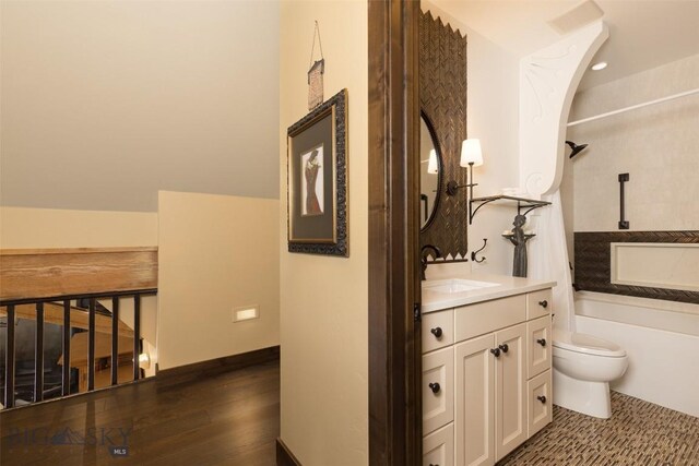 45 Cutthroat Trout, Big Sky, MT 59716 - full bath with toilet, vanity, shower / bath combination, and wood finished floors