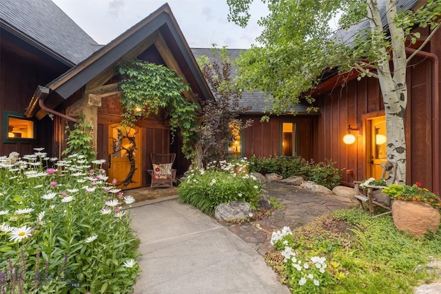 45 Cutthroat Trout, Big Sky, MT 59716 - doorway to property featuring a shingled roof and board and batten siding