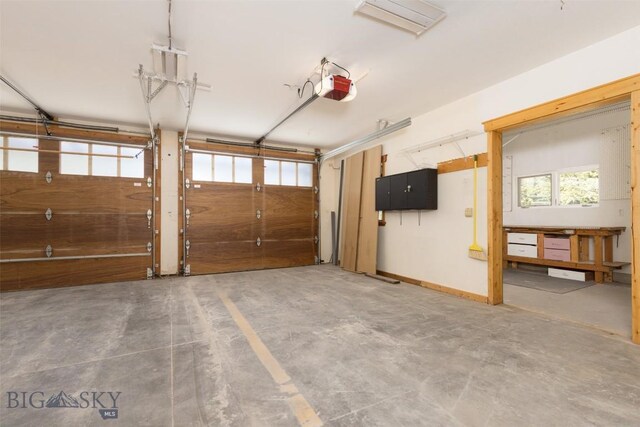 45 Cutthroat Trout, Big Sky, MT 59716 - garage featuring a garage door opener